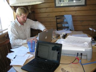 Galen Kaip, of UTEP, sorts through meta-data at the Puntzi Lake instrument center to prepare the data for archiving as a PH5 data set.  Batholiths Controlled Source Experiment 2009, British Columbia, Canada.